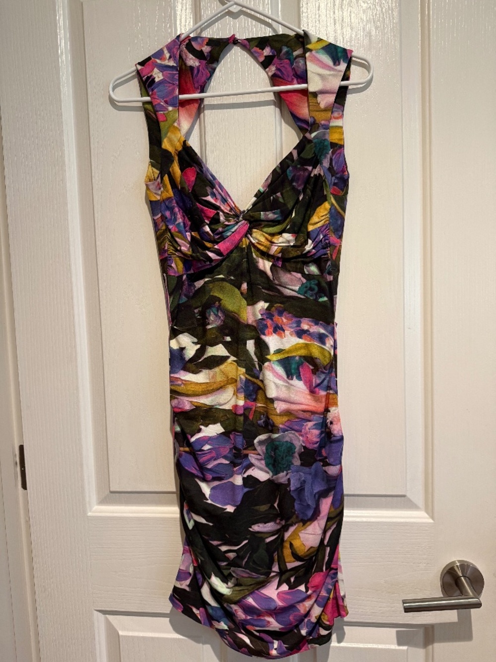 Nicole Miller Artelier multi color cut out dress. Form fitting and slimming.